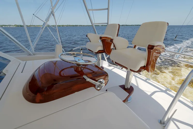 Time Away Yacht Photos Pics 2019 Viking 48 Convertible yacht helm with dual captain chairs on open water.