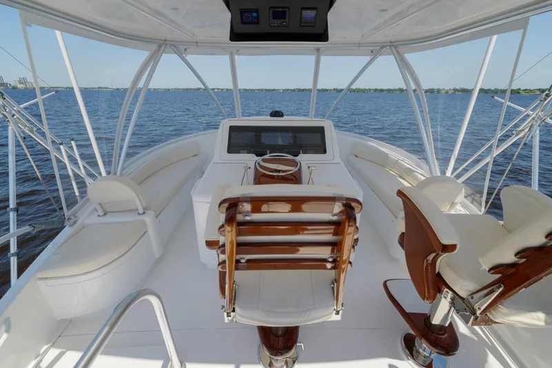 Time Away Yacht Photos Pics 2019 Viking 48 Convertible yacht helm with luxurious seating and ocean view.