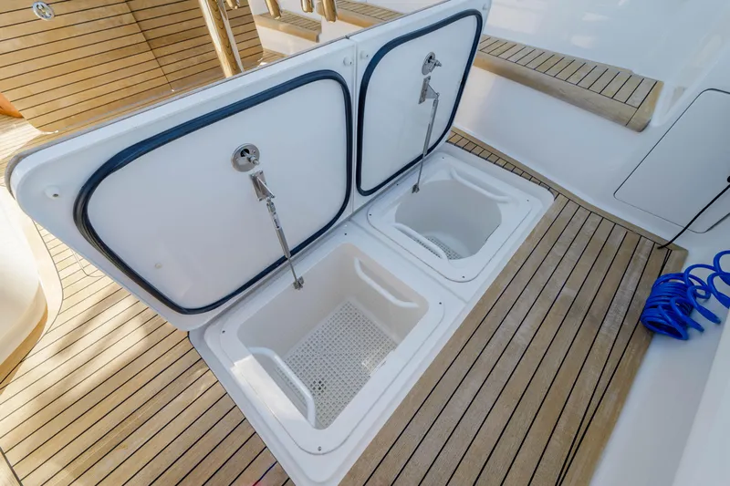 Time Away Yacht Photos Pics 2019 Viking 48 Convertible yacht with open storage compartments on teak deck.