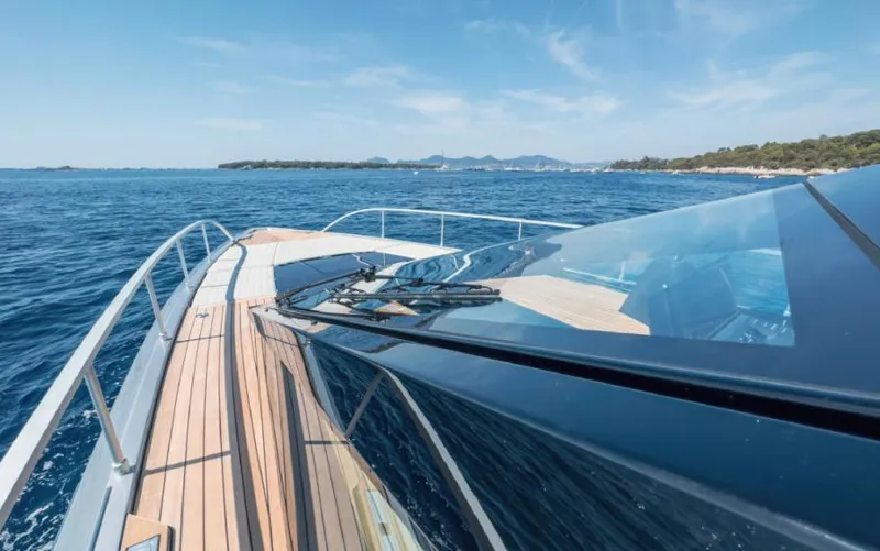  Yacht Photos Pics 2023 Wally WALLYPOWER 58X yacht cruising on open sea with clear skies.