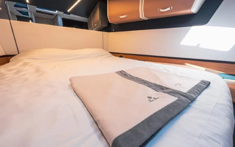  Yacht Photos Pics Luxurious cabin interior of 2023 Wally WALLYPOWER 58X yacht with elegant bedding.