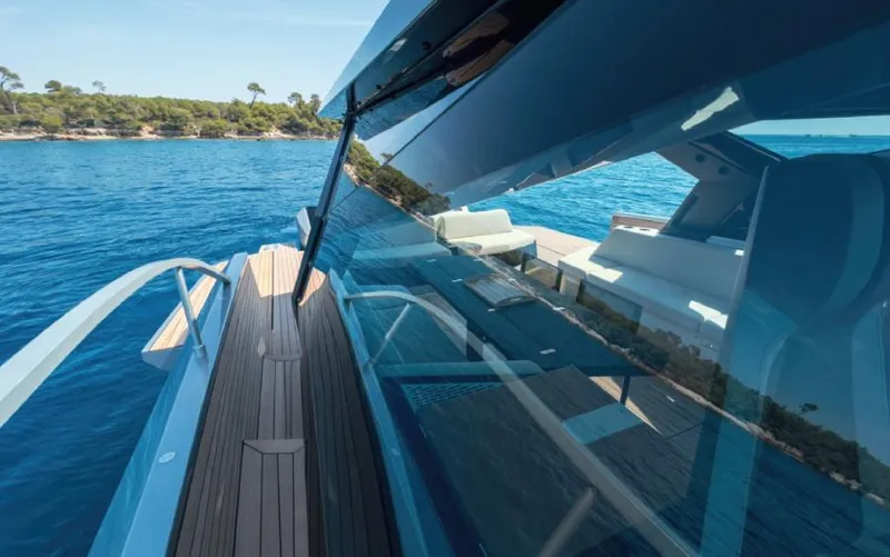  Yacht Photos Pics 2023 Wally WALLYPOWER 58X yacht on serene blue waters, showcasing sleek design and luxury.