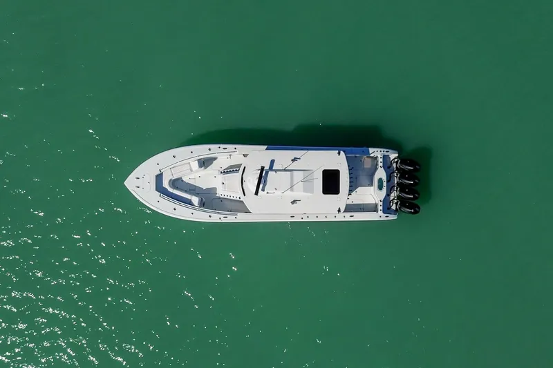  Yacht Photos Pics Aerial view of 2024 Yellowfin 42 Offshore boat on turquoise water.