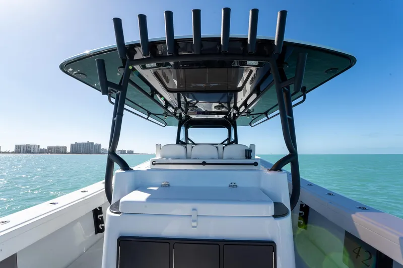  Yacht Photos Pics 2024 Yellowfin 42 Offshore boat on calm sea with clear blue sky.