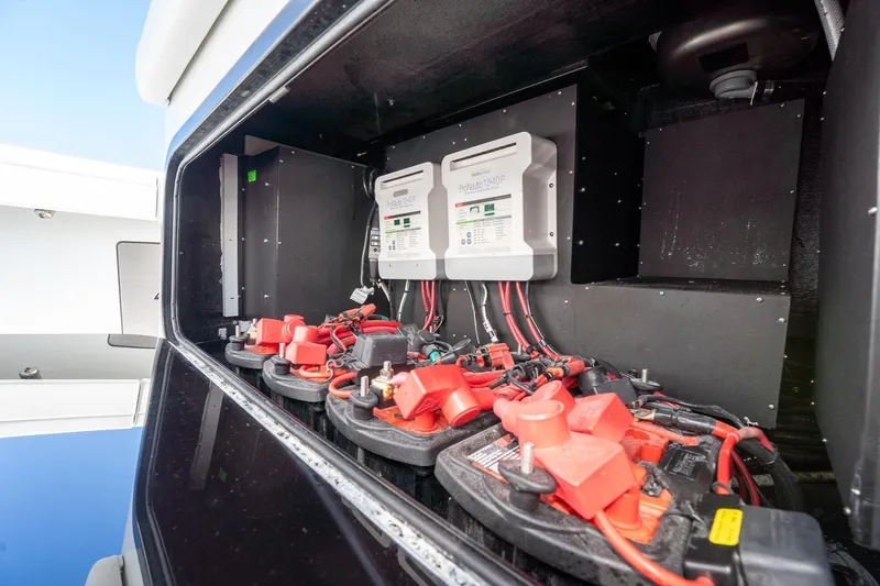  Yacht Photos Pics 2024 Yellowfin 42 Offshore boat battery compartment with wiring and chargers.