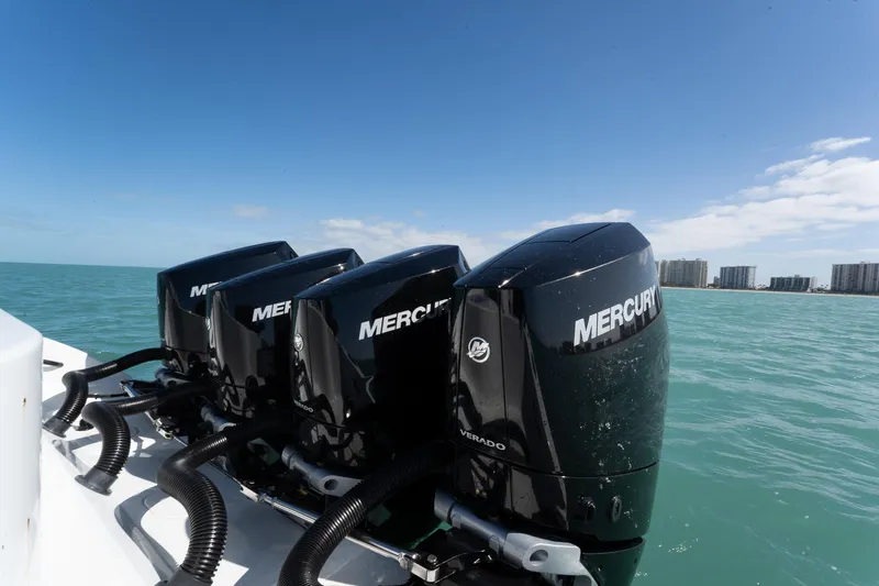  Yacht Photos Pics 2024 Yellowfin 42 Offshore boat with four Mercury Verado engines on open water.