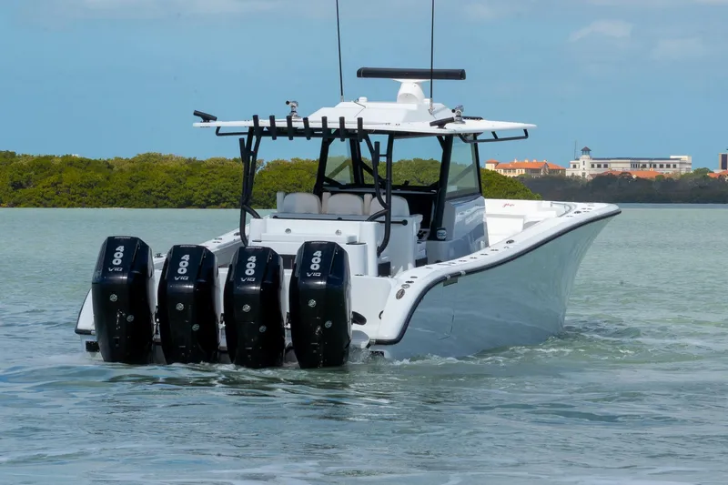  Yacht Photos Pics 2024 Yellowfin 42 Offshore boat with quad 400 V10 engines on calm water.