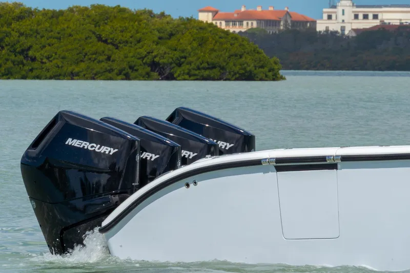  Yacht Photos Pics 2024 Yellowfin 42 Offshore boat with Mercury engines on calm water.