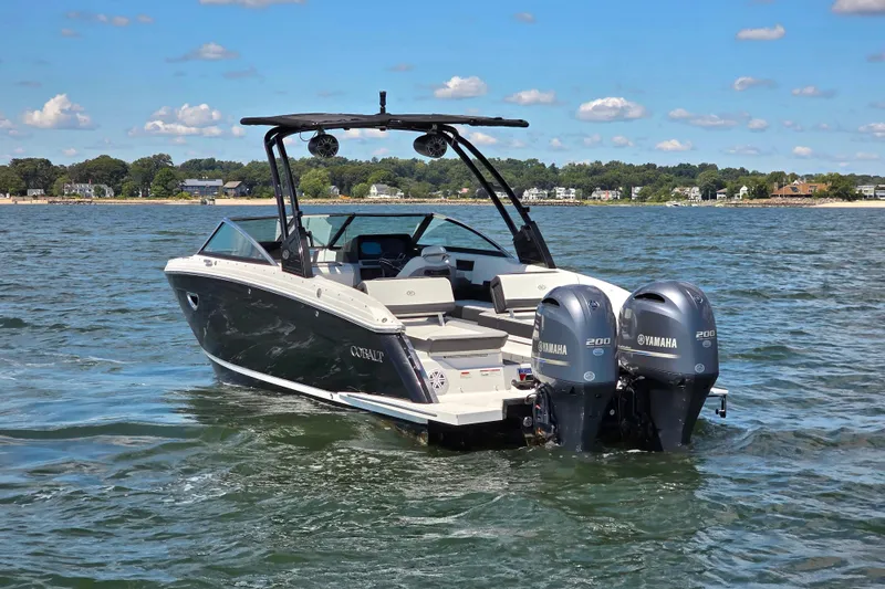  Yacht Photos Pics 2024 Cobalt R8 Outboard boat with dual Yamaha engines on a sunny lake.