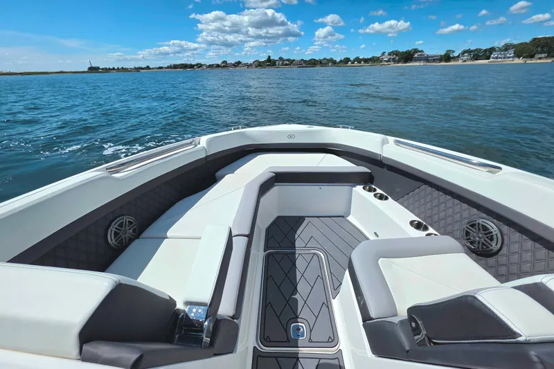  Yacht Photos Pics 2024 Cobalt R8 Outboard boat interior with luxurious seating on a sunny day.