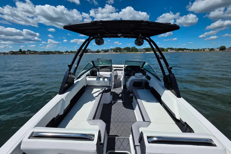  Yacht Photos Pics 2024 Cobalt R8 Outboard boat interior on a sunny day, featuring sleek seating and modern design.