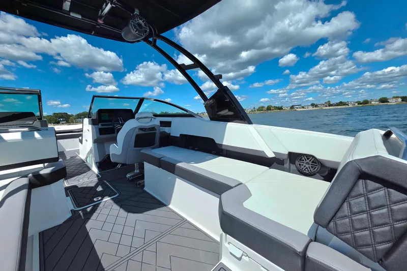  Yacht Photos Pics 2024 Cobalt R8 Outboard boat interior with sleek seating, modern design, and scenic water view.