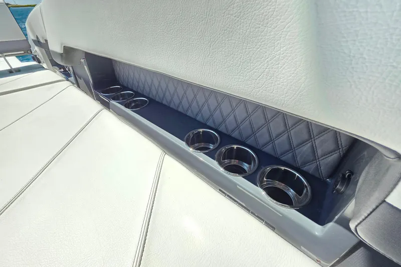  Yacht Photos Pics 2024 Cobalt R8 Outboard boat interior with cup holders and quilted leather detailing.