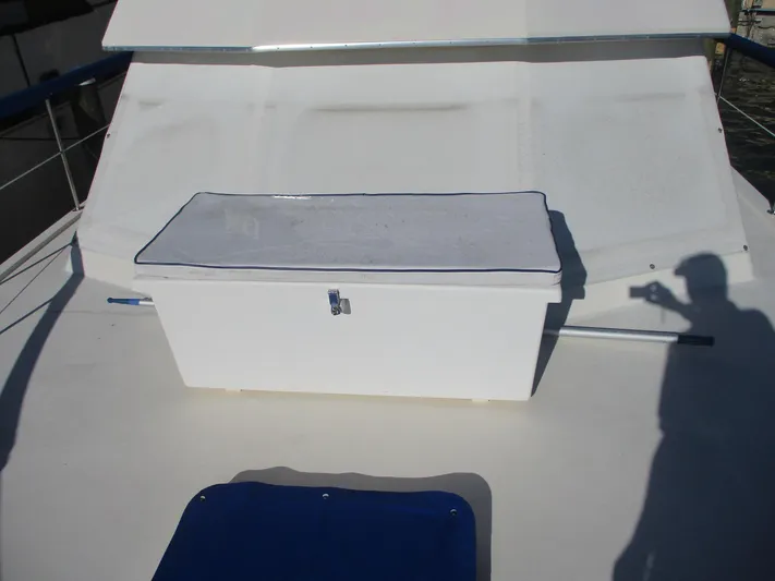  Yacht Photos Pics 1986 Hatteras 43 Double Cabin deck with storage box and shadow.