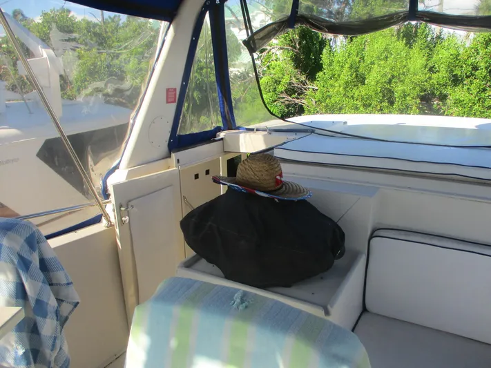 Yacht Photos Pics 1986 Hatteras 43 Double Cabin interior with sun hat and striped towel.
