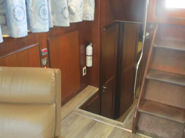  Yacht Photos Pics Interior of 1986 Hatteras 43 Double Cabin with stairs and wood paneling.