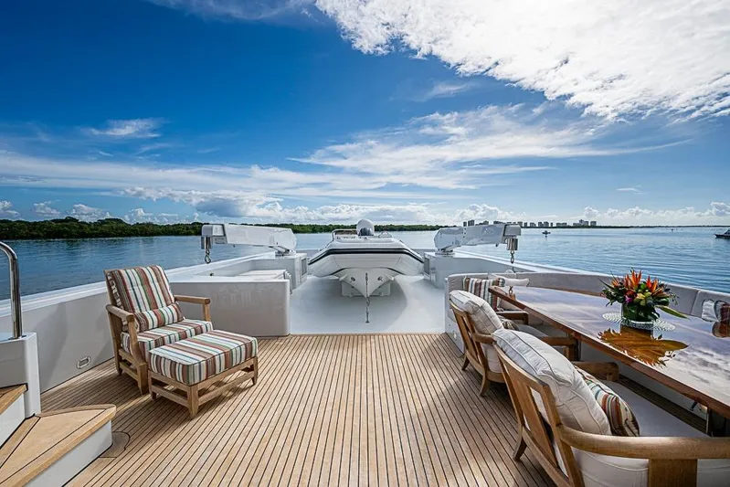 Probability Yacht Photos Pics Luxurious 1997 Delta Marine yacht deck with seating, table, and scenic ocean view.