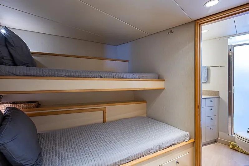 Probability Yacht Photos Pics Bunk beds in a 1997 Delta Marine yacht cabin with adjacent bathroom.