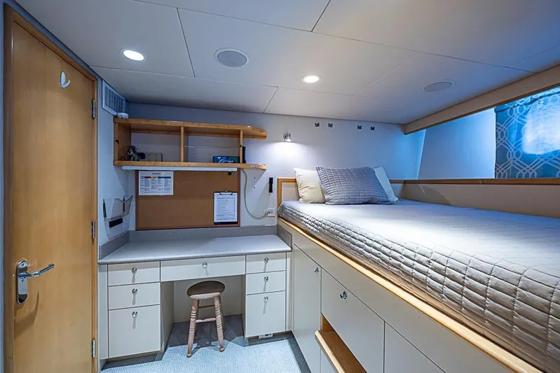 Probability Yacht Photos Pics Luxurious 1997 Delta Marine yacht cabin with bed, desk, and storage.