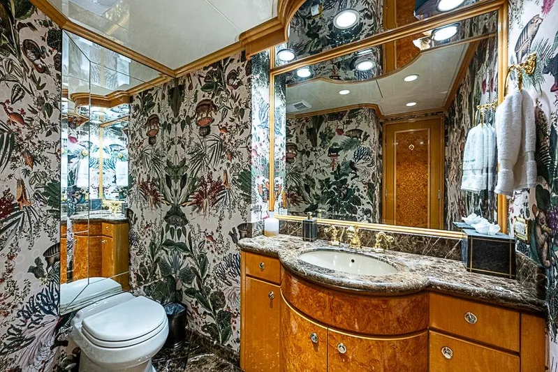 Probability Yacht Photos Pics Luxurious yacht bathroom with floral wallpaper, marble countertop, and elegant fixtures, Delta Marine 1997.