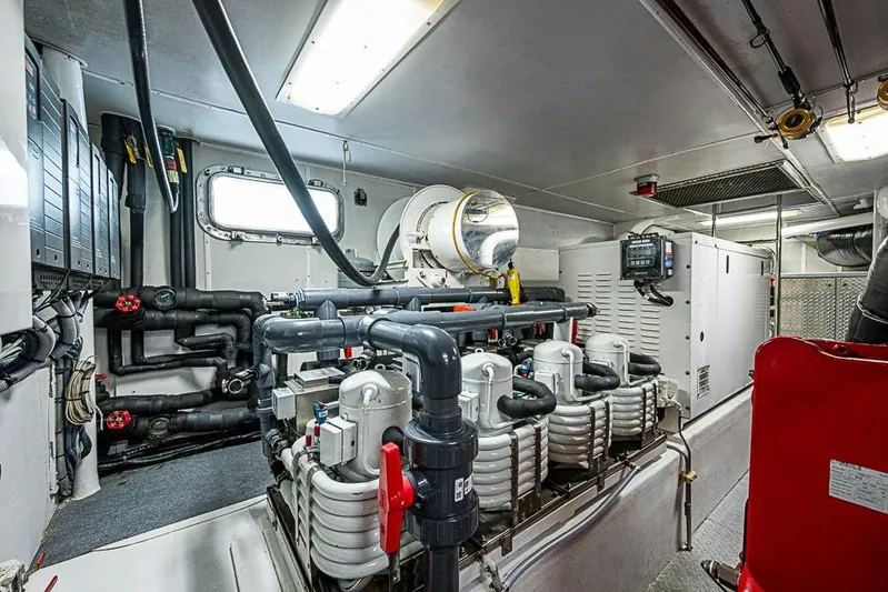 Probability Yacht Photos Pics Engine room of a 1997 Delta Marine vessel, featuring complex piping and machinery.