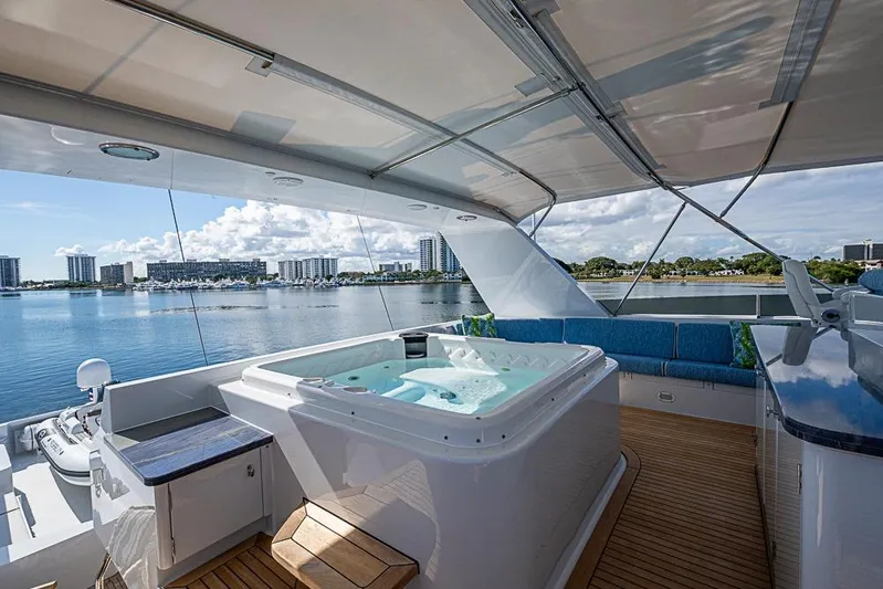 Probability Yacht Photos Pics Luxurious 1997 Delta Marine yacht deck with hot tub and scenic waterfront view.