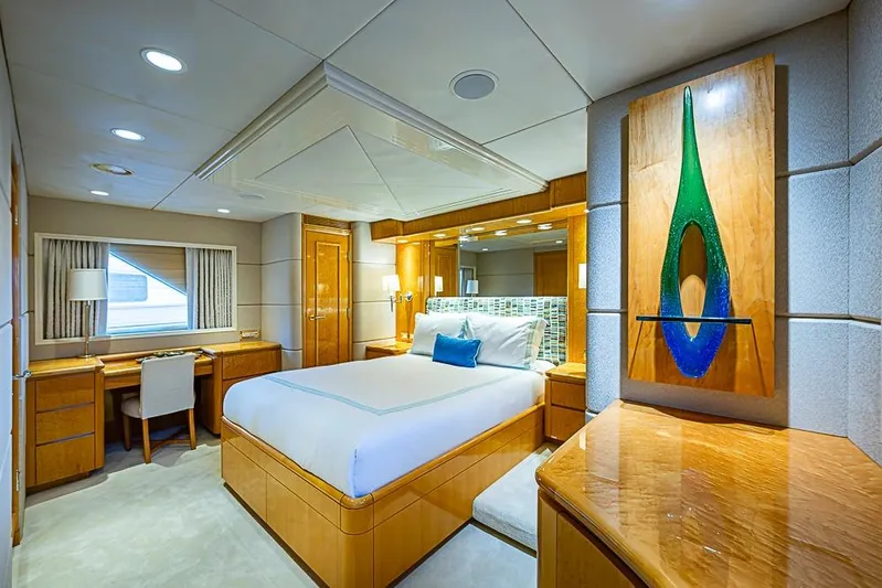 Probability Yacht Photos Pics Luxurious Delta Marine yacht bedroom, 1997, featuring elegant wood furnishings and modern decor.