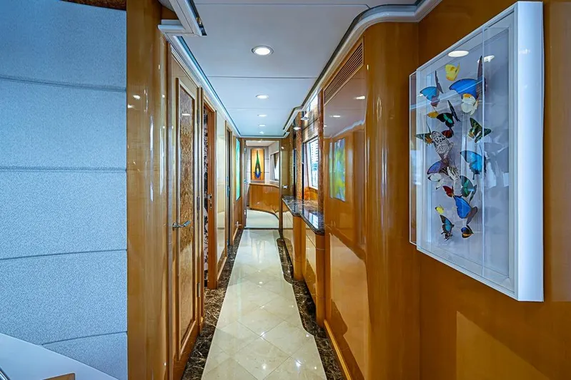Probability Yacht Photos Pics Luxurious yacht interior hallway with wood paneling and butterfly artwork, Delta Marine 1997.