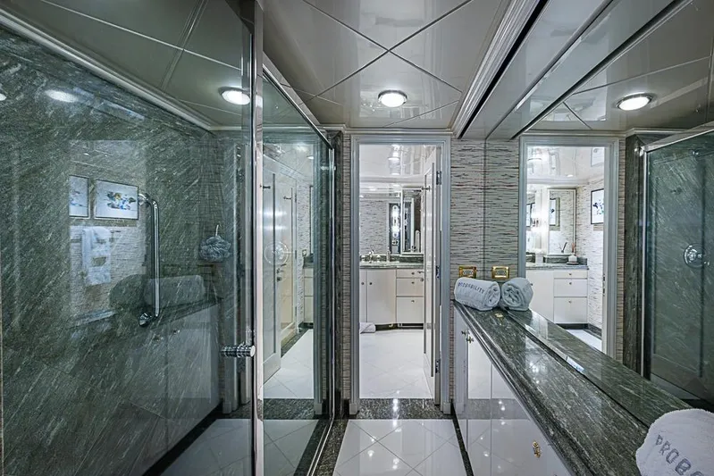 Probability Yacht Photos Pics Luxurious yacht bathroom with marble finishes, glass shower, and elegant lighting, Delta Marine 1997.