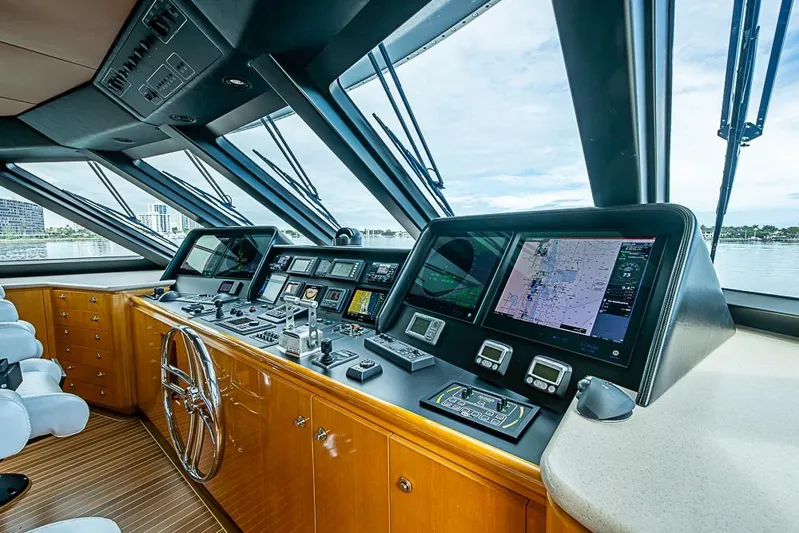 Probability Yacht Photos Pics Luxurious 1997 Delta Marine yacht cockpit with advanced navigation systems and panoramic windows.