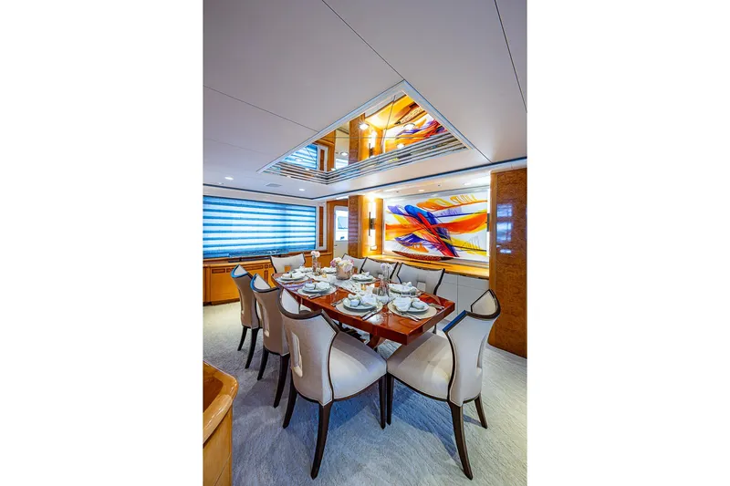 Probability Yacht Photos Pics Luxurious dining area on a 1997 Delta Marine yacht with elegant decor and modern art.