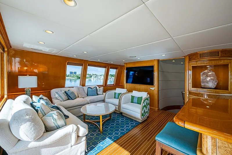 Probability Yacht Photos Pics Luxurious 1997 Delta Marine yacht interior with elegant seating, wooden accents, and large windows.