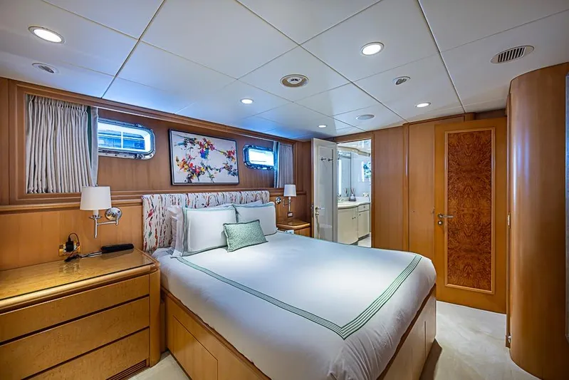 Probability Yacht Photos Pics Luxurious 1997 Delta Marine yacht bedroom with elegant wood paneling and modern decor.