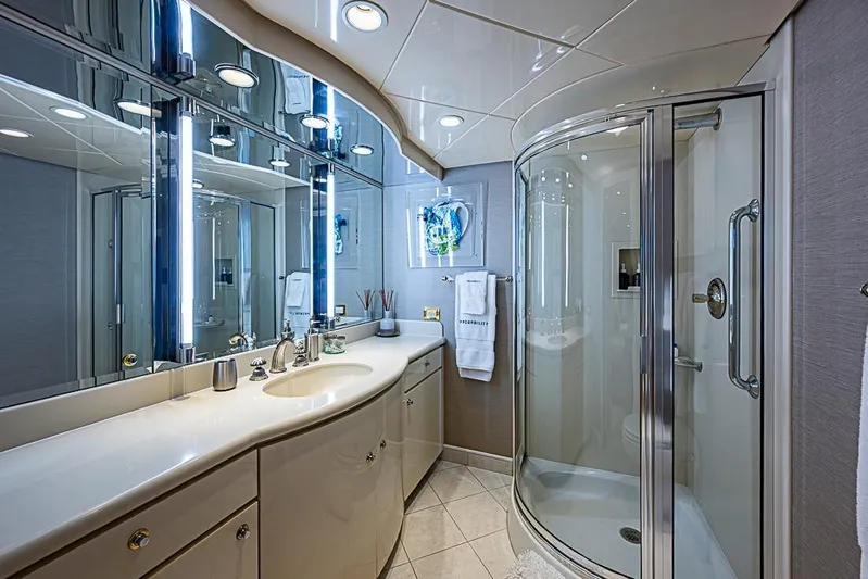 Probability Yacht Photos Pics Luxurious yacht bathroom with modern fixtures, glass shower, and elegant lighting, Delta Marine 1997.