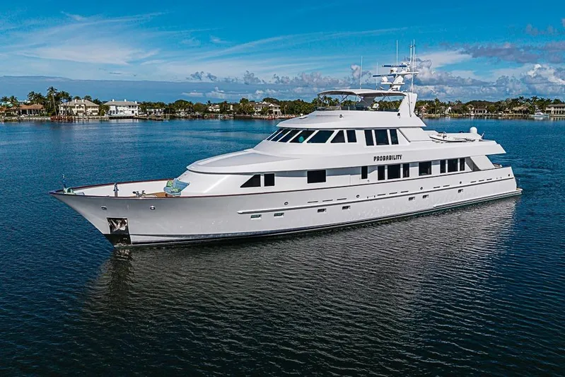 Probability Yacht Photos Pics Luxury 1997 Delta Marine yacht cruising on calm waters under a clear blue sky.