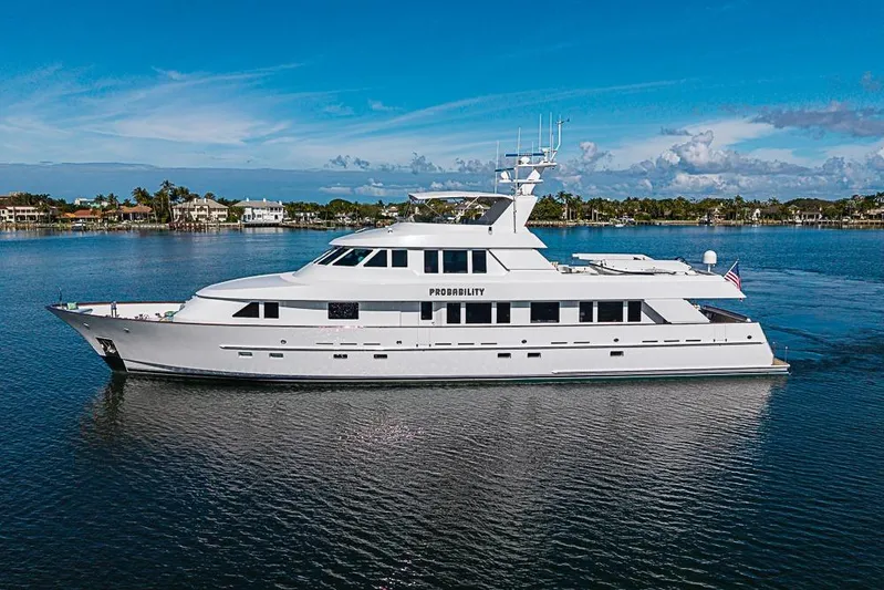 Probability Yacht Photos Pics Luxury 1997 Delta Marine yacht on calm water under clear blue sky.