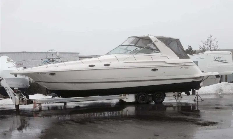  Yacht Photos Pics 1998 Cruisers Yachts 3870 Express on trailer in a snowy marina setting.