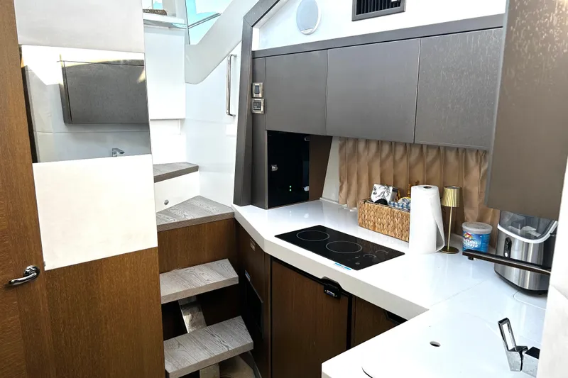 Zantical Yacht Photos Pics Modern kitchen interior of 2020 Galeon 425 HTS yacht with sleek cabinetry and appliances.