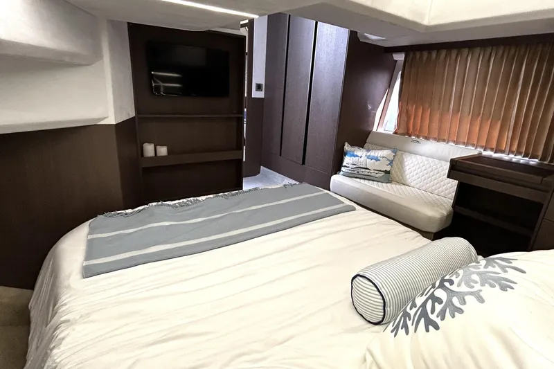 Zantical Yacht Photos Pics Luxurious interior of 2020 Galeon 425 HTS yacht with cozy bed and elegant decor.