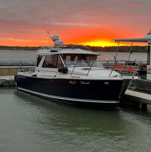  Yacht Photos Pics 2021 Cutwater C-28 boat docked at sunset with vibrant sky.