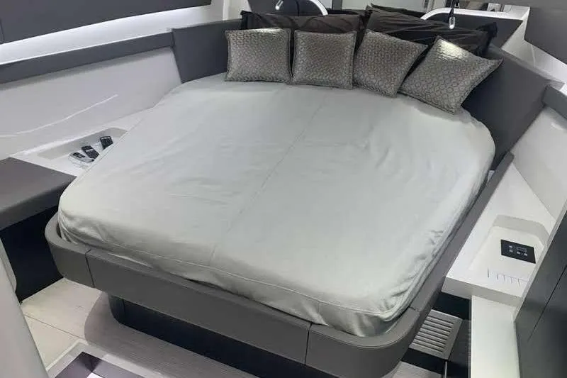 Malola Yacht Photos Pics Luxurious interior of 2022 Canados Gladiator 431 WA yacht with elegant bedding and cushions.