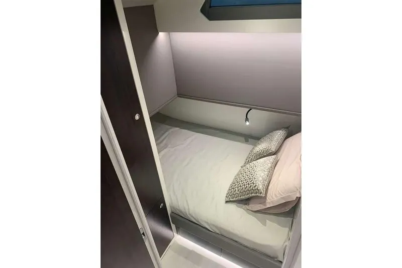 Malola Yacht Photos Pics 2022 Canados Gladiator 431 WA cabin interior with cozy bed and modern lighting.