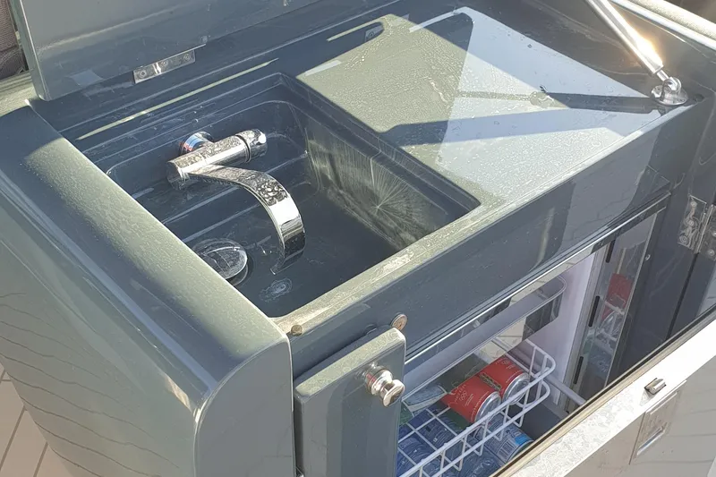 Malola Yacht Photos Pics Outdoor sink and mini fridge on 2022 Canados Gladiator 431 WA yacht.