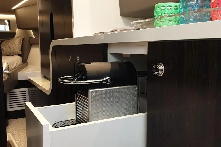 Malola Yacht Photos Pics 2022 Canados Gladiator 431 WA interior with coffee machine and modern cabinetry.