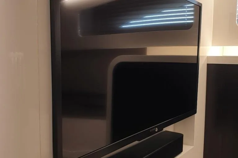 Malola Yacht Photos Pics Flat-screen TV in a modern interior, Canados Gladiator 431 WA, 2022 model.