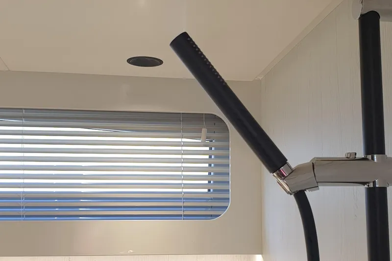 Malola Yacht Photos Pics Interior of 2022 Canados Gladiator 431 WA yacht with modern blinds and sleek fixtures.