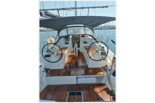  Yacht Photos Pics 2022 Jeanneau Sun Odyssey 380 sailboat with dual steering wheels and teak deck.