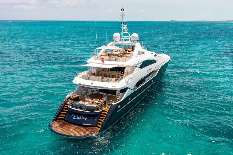 Marin Yacht Photos Pics Luxurious 2014 Sunseeker 131 yacht cruising in clear turquoise waters.
