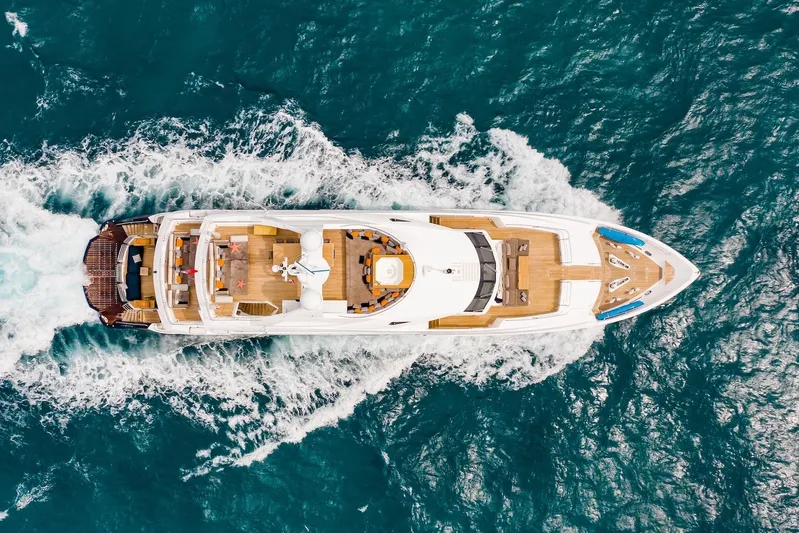 Marin Yacht Photos Pics Aerial view of 2014 Sunseeker 131 yacht cruising on blue ocean waters.