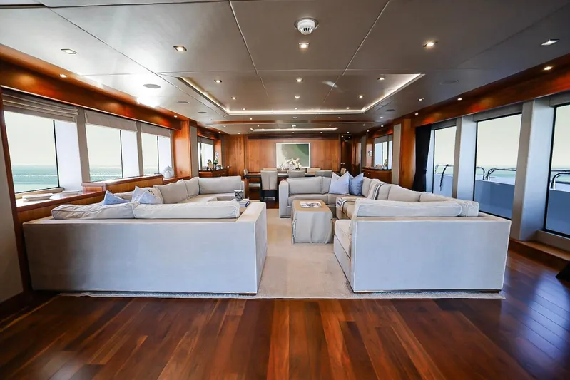 Marin Yacht Photos Pics Luxurious interior of 2014 Sunseeker 131 yacht with elegant seating and panoramic windows.